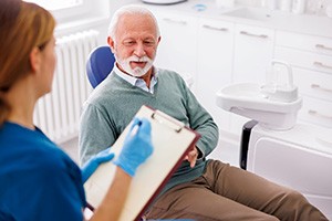 a patient speaking with their dentist 