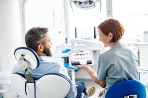 a patient speaking with a dental treatment coordinator
