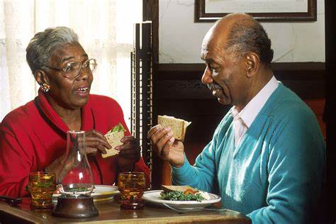 older couple eating with dentures